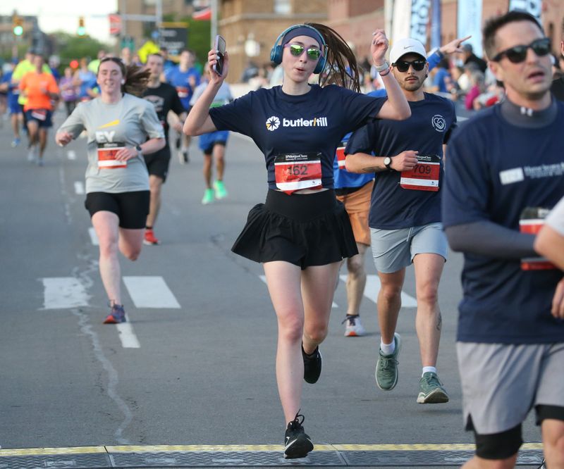 Runners charge towards the finish line at the Rochester JPMorganChase Corporate Challenge road race Thursday, May 21, 2026.