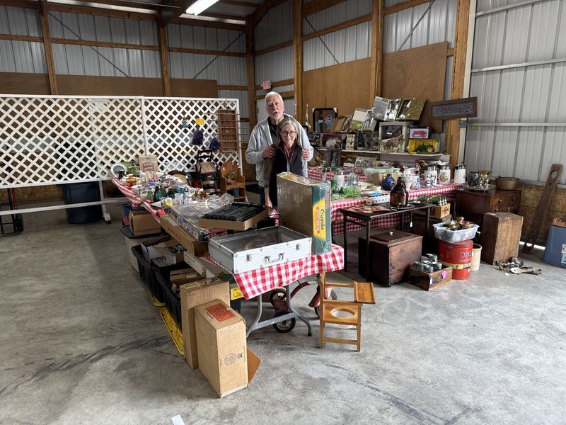 Bob and Carol Levis set up their antique table preparing for Saturday and Sunday's Finger Lakes Antique Show.
