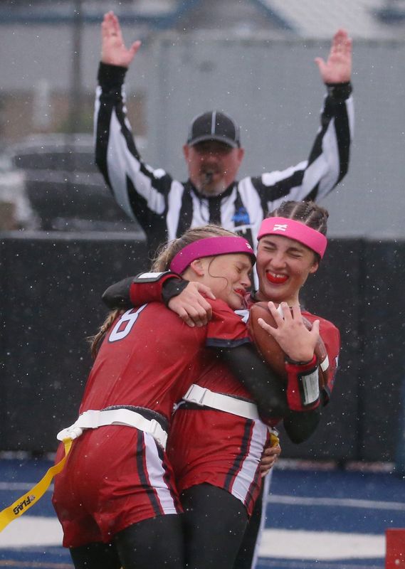 Hornell’s Mia Nasca celebrates with teammate Parker Graham (8) after her reception in the end zone for the extra point in the second quarter, giving Hornell the 14-0 lead during their Section V flag football sectionals Class C1 final Saturday, May 23, 2026 at Gates Chili High School.