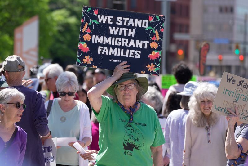 Sue Secaur of Scipio, Cayuga County joins dozens of people who came out to the Kenneth B. Keating Federal Building in Rochester on May 26, 2026 to rally in support of Dolores Bustamante before Bustamante’s hearing. She was detained by U.S. Immigration Cusoms and Enforcement in April when she was attending her ICE check-in.
