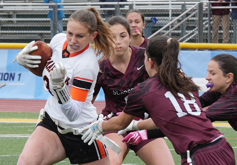 Mamaroneck’s Sarah Sherman (3) tries to avoid Scarsdale defenders on a first half run doing he Section 1 Class A flag football championship at Lakeland High School in Shrub Oak May 23, 2026. Mamaroneck won the game 13-7.