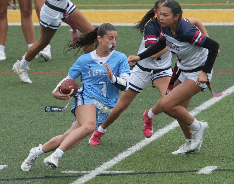 Westlake/Briarcliff ’s Juliana DiMarino (3) breaks away from Byram Hills defenders on a first half touchdown run during the Section 1 Class C flag football championship at Lakeland High School in Shrub Oak May 23, 2026. Westlake/Briarcliff won the game.
