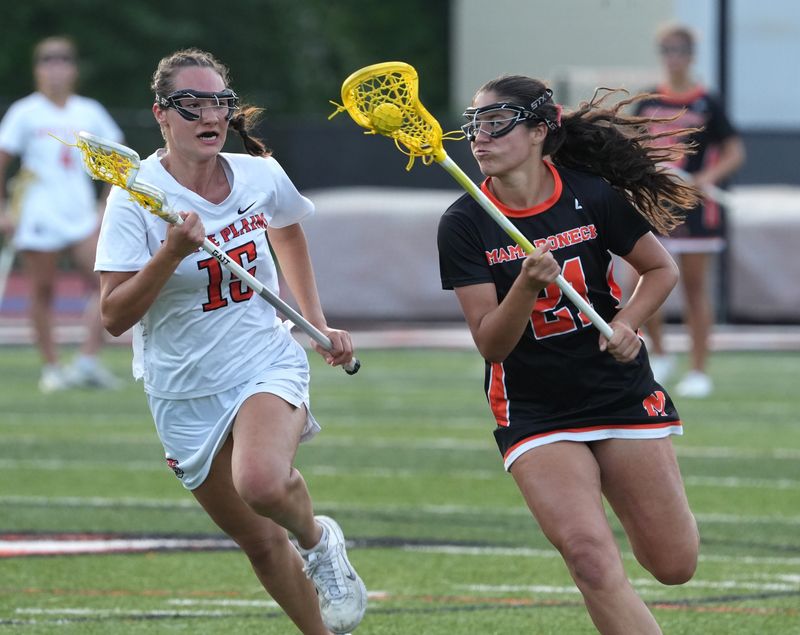 Mamaroneck's Lucy Bevilacqua is pressured by White Plains' Francesca Marcotullio during a Section 1 Class A girls lacrosse quarterfinal at White Plains May 27, 2026. Mamaroneck won 19-10.