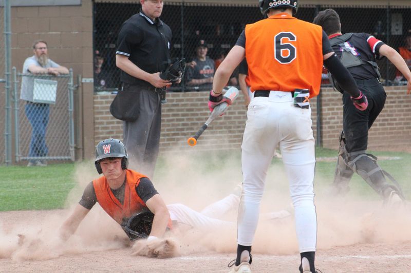 Brennen Geffers slides into home to score the clinching run as Wellsville defeated B-R/C-R 11-1 Wednesday, May 27, 2026 to advance to Saturday's Class B2 championship game.