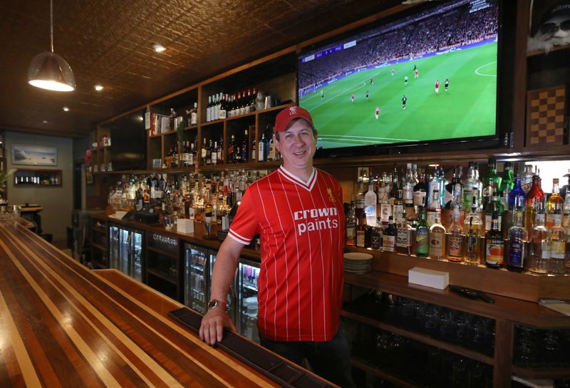 Owner Joe McBane behind the bar at The Sheffield on Monroe Ave in Brighton, NY Thursday, May 28, 2026. McBane is getting ready for the FIFA World Cup where games will be shown on all of his television sets around the bar.