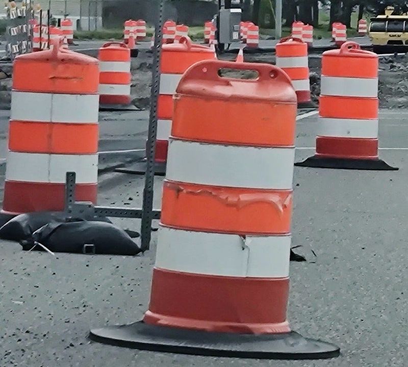 A road work cone guides traffic.