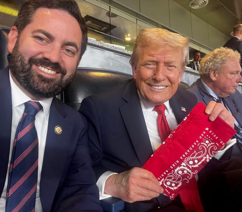 Republican Rockland County Congressman Mike Lawler presents a red bandana to President Donald Trump in honor of Welles Crowther who died while rescuing people from the South Tower on September 11, 2001