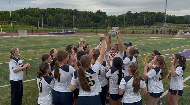 The Highland girls lacrosse team celebrates with the championship plaque after defeating O'Neill 10-6 in the Section 9 Class D championship at Monroe-Woodbury on May 29.