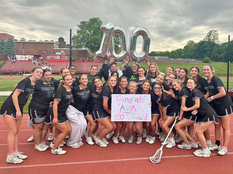 The Yorktown girls lacrosse team poses in celebration of Ava Ryan, who scored her 100th career goal during their Section 1 Class B semifinal win on May 29, 2026.