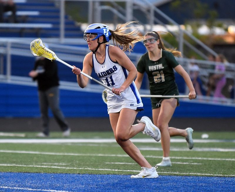 Horseheads' CarLynn Sindlinger (11) scored 8 goals as the Blue Raiders defeated Vestal, 19-4, in the Section 4 Class B girls lacrosse championship game May 29, 2026 at Horseheads High School.