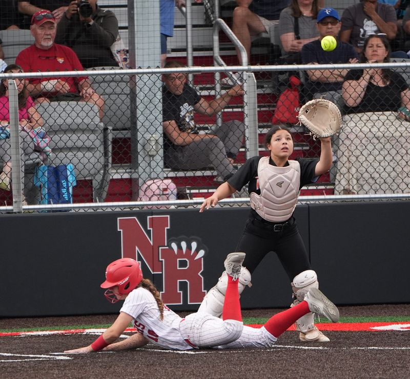 North Rockland's Tara Murphy (10) slides in safe at home during the Section 1 Class AAA softball semifinal at North Rockland High School in Thiells on Friday, May 29, 2026. North Rockland won 7-6.