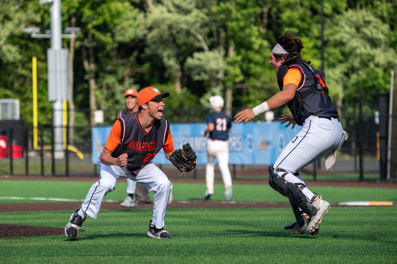 Mamaroneck pitcher Noah Bauer and catcher Kevin Comblo celebrate after Mamaroneck defeated Roy C. Ketcham 2-0 on May 31 for the Section 1 Class AAA baseball championship at North Rockland High School in Thiells.
