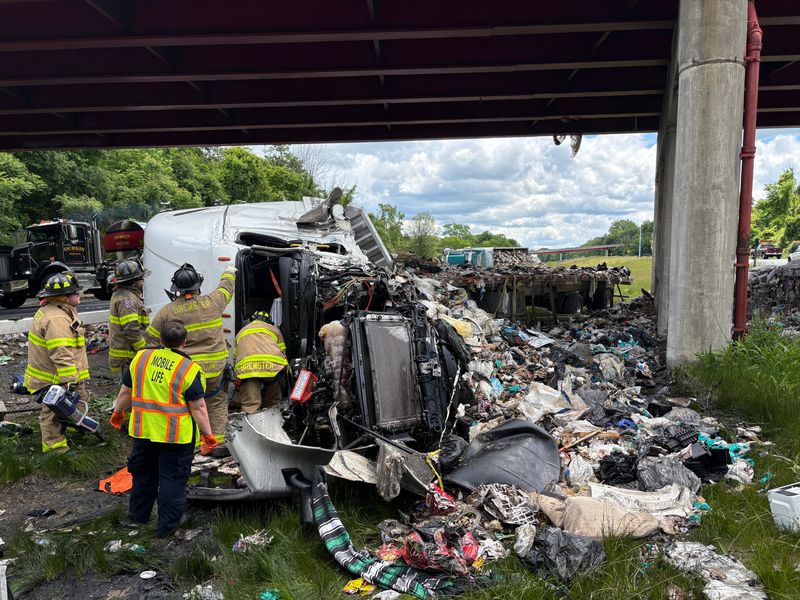 Two tractor-trailers overturned on Interstate Route 84 in the town of Southeast Monday, June 1, 2026 after a motor vehicle collision. Both drives sustained non-life threatening injuries, police said. The trucks, which were both carrying garbage, spilled debris onto both sides of the highway.