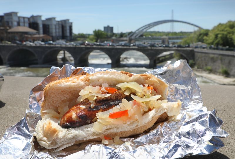 Enjoying a ‘white hot’ hot dog fresh off the grill at Haddad's Best in downtown Rochester Tuesday, June 2, 2026.