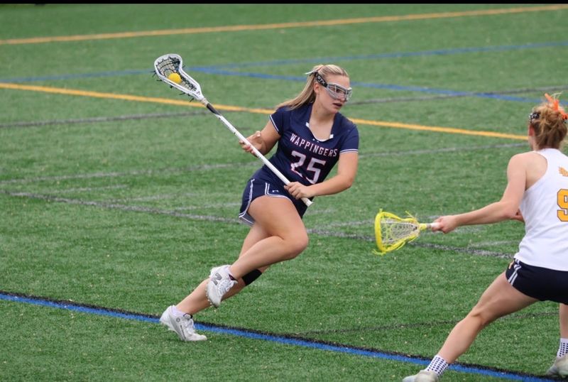 Wappingers girls lacrosse junior Grace Jesman runs with the ball during a game this season