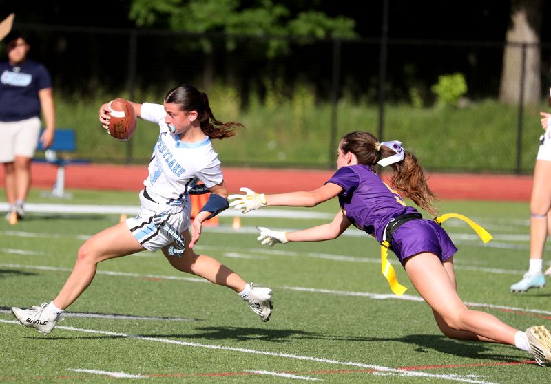 Westlake/Briarcliff’s Juliana DiMarino breaks away from Rhinebeck’s Charlie Padgen during the NYSPHAA Regional Championship Flag Football game on June 2, 2026.