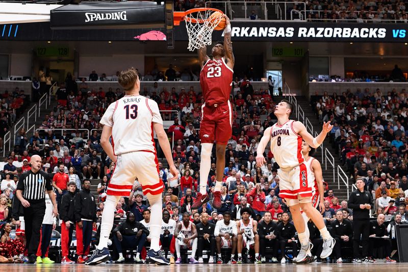 Mar 26, 2026; San Jose, CA, USA; Arkansas Razorbacks forward Nick Pringle (23) dunks against Arizona Wildcats forward Ivan Kharchenkov (8) in the first half during a Sweet Sixteen game of the West Regional of the men's 2026 NCAA Tournament at SAP Center. Mandatory Credit: Eakin Howard-Imagn Images