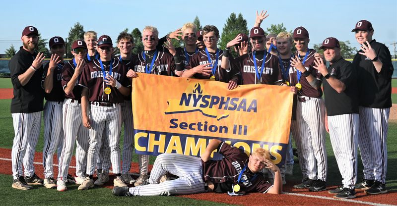 The Oriskany Skyhawks pose with the Section III championship banner following an 8-4 win over McGraw Tuesday at Onondaga Community College in Syracuse.