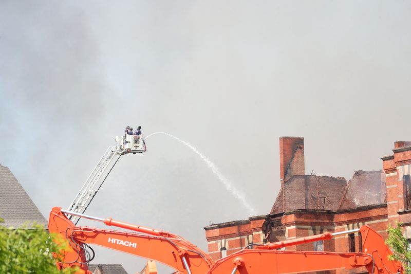The a fire department sprays water on the former Hudson River Psychiatric Hospital as it burns due to a fire on June 3, 2026.