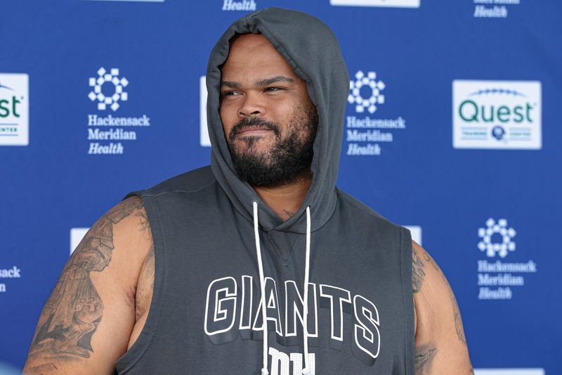 Jun 3, 2026; East Rutherford, NJ, USA; New York Giants guard Jermaine Eluemunor (72) talks with media after organized team activities at Quest Diagnostics Training Center. Mandatory Credit: Vincent Carchietta-Imagn Images
