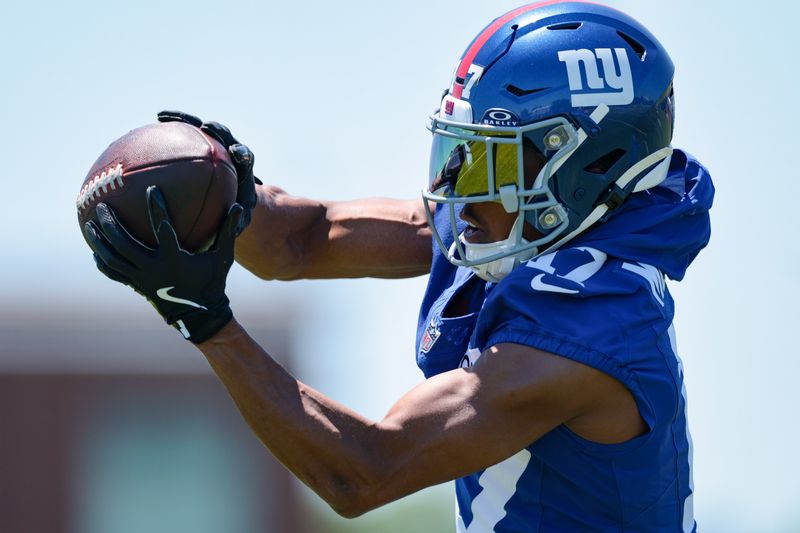 Jun 3, 2026; East Rutherford, NJ, USA; New York Giants wide receiver Darnell Mooney (17) catches the ball during organized team activities at Quest Diagnostics Training Center. Mandatory Credit: Vincent Carchietta-Imagn Images