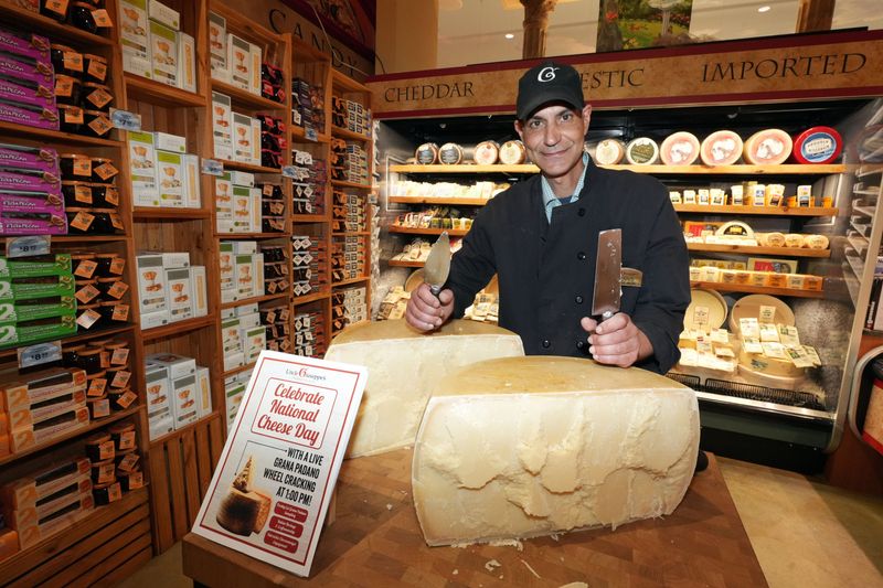Cheese manager Dennis Linkowski with a wheel of aged Italian Grana Padano cheese and the tools he used to crack it at Uncle Giuseppe's Marketplace in Yorktown Heights June 4, 2026.