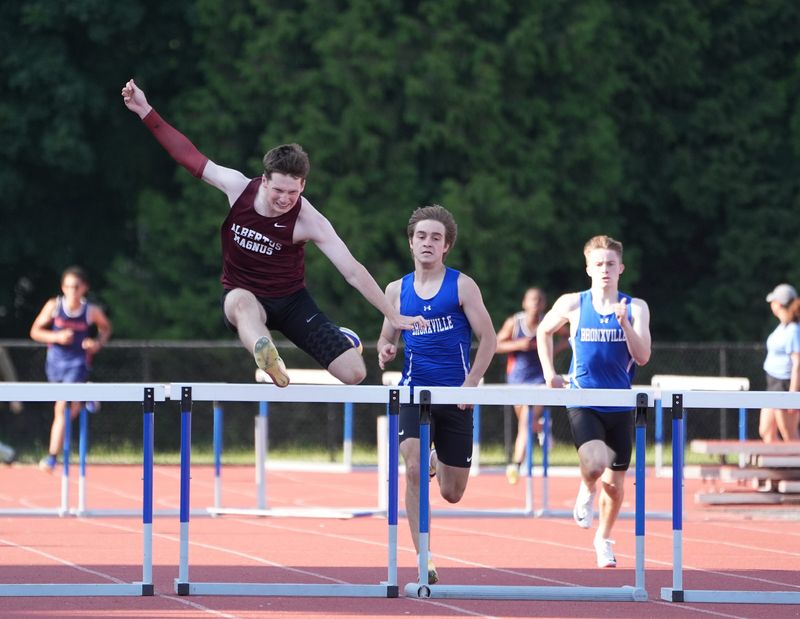 Albertus Magnus' Heath Miller takes first in the 400-meter hurdles with a state qualifying time of 56.34 during day 2 of the Section 1 State Qualifier Track & Field Meet at Suffern Middle School in Suffern on Friday, June 5, 2026.