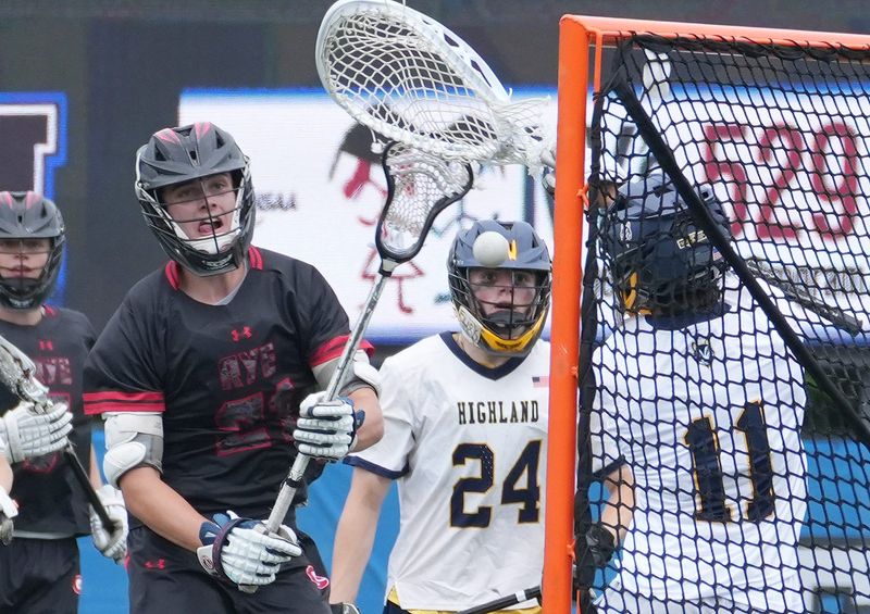 Rye’s Sam Scully (21) scores a first half goal against Highland during the the boys state lacrosse Class C regional final at Middletown High School June 6, 2026. Rye won the game 19-3.