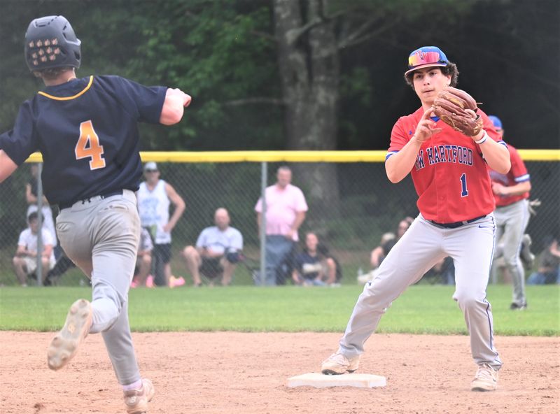 New Hartford shortstop Joe Perrotta (right) forces out an Averill Park runner at second base during Saturday's Class A regional baseball playoff game at Keenholts Park.