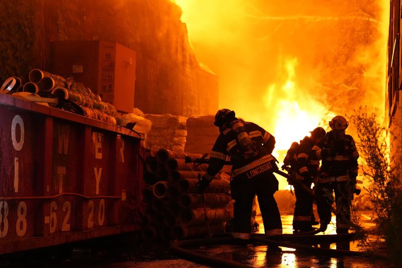 Firefighters battle a five-alarm fire at Pallet Express on Lyell Avenue on June 7 and 8, 2026. No injuries were reported.