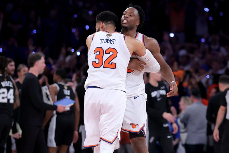 New York Knicks center Karl-Anthony Towns hugs forward OG Anunoby after Anunoby's go ahead basket late during the fourth quarter of game four of the 2026 NBA Finals against the San Antonio Spurs at Madison Square Garden.