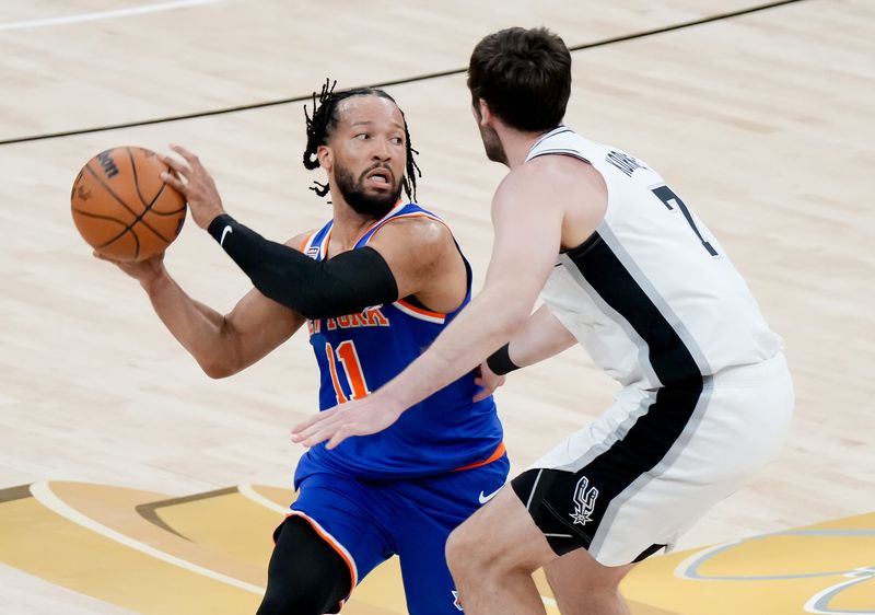 Jun 13, 2026; San Antonio, Texas, USA; New York Knicks guard Jalen Brunson (11) dribbles the ball against San Antonio Spurs center Luke Kornet (7) in the first half during game five of the 2026 NBA Finals at Frost Bank Center. Mandatory Credit: Scott Wachter-Imagn Images