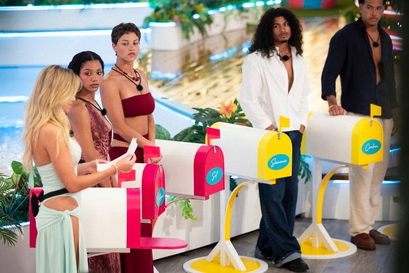 Islanders stand during a recoupling ceremony on Love Island, which ended without an elimination and led into a fan vote.