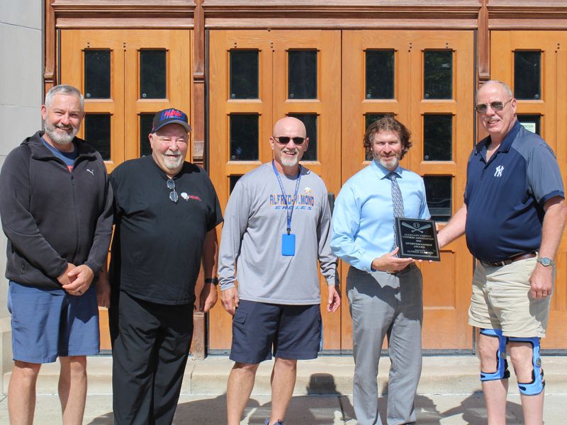 Pictured left to right: Burt Turner, Bob Brookes, Greg Cook, Steve Donlon and Tom Hanbach as Alfred-Almond received the 2026 Allegany County Umpires Association Sportsmanship Award.