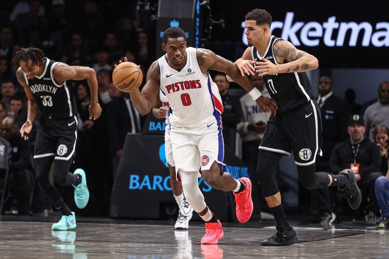 Mar 10, 2026; Brooklyn, New York, USA;  Detroit Pistons center Jalen Duren (0) drives past Brooklyn Nets forward Michael Porter Jr. (17) in the third quarter at Barclays Center. Mandatory Credit: Wendell Cruz-Imagn Images