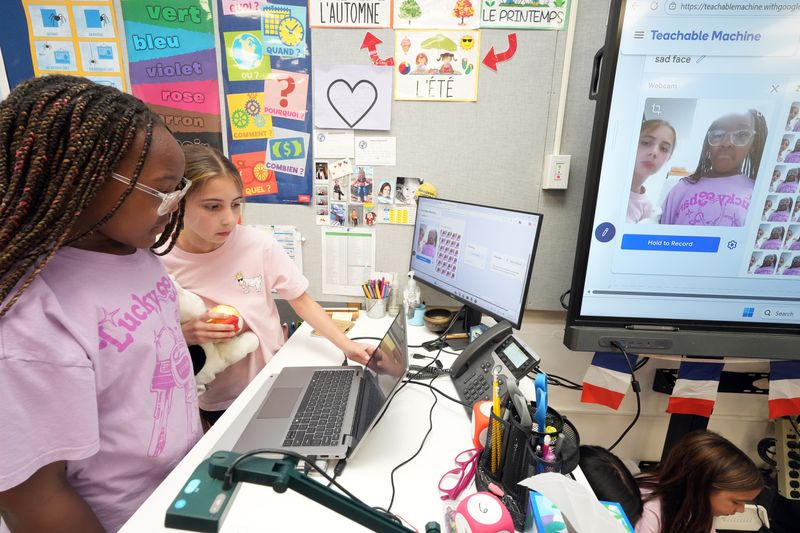 Fourth-graders Addison Ewing, left, and Willa Petruzzelli train an AI model in AI Junior, an afterschool club to provide elementary students with knowledge and skills to use AI ethically and responsibly, at Pocantico Hills Central School June 10, 2026 in Pocantico.