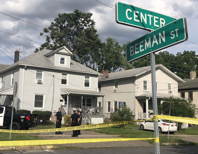 Canandaigua police officers and Ontario County sheriff's deputies prepare to enter a Center Street home in the city of Canandaigua on June 24. Parts of Center and Beeman streets were blocked off during an investigation.