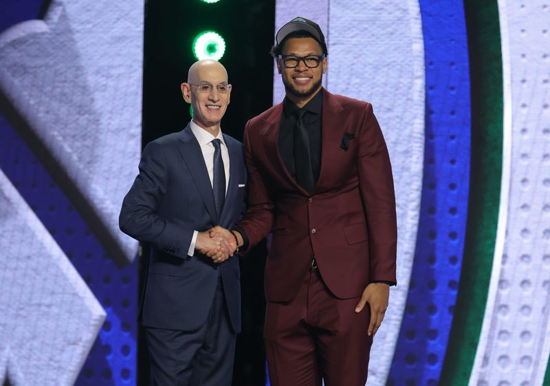 Jun 23, 2026; New York, NY, USA; NBA commissioner Adam Silver greets the twenty eighth pick in the 2026 NBA draft, Iowa State forward Joshua Jefferson after he was selected by the Minnesota Timberwolves at Barclays Center. Mandatory Credit: Brad Penner-Imagn Images