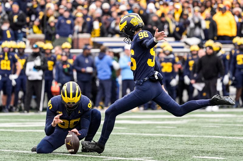 Michigan kicker Dominic Zvada (96) attempts a field goal against Ohio State during the first half at Michigan Stadium in Ann Arbor on Saturday, Nov. 29, 2025.