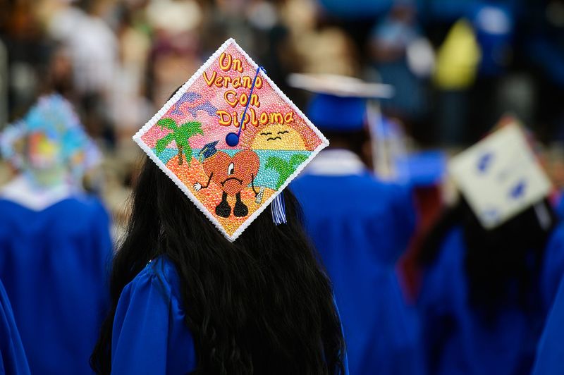 Graduates walk in the processional during the Middletown High School commencement ceremony at Faller Field on Friday, June 26, 2026.