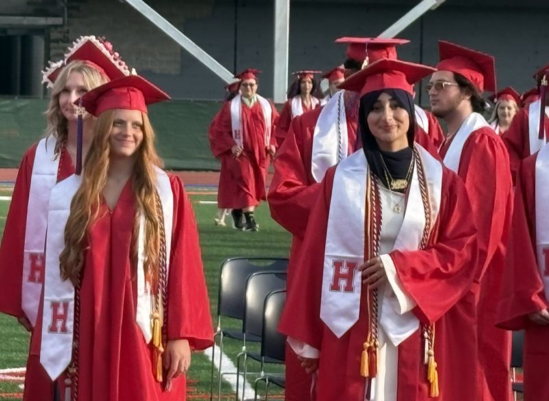 Members of the Hornell High School Class of 2026 are all smiles at the school's graduation ceremony in Maple City Park on June 26, 2026.
