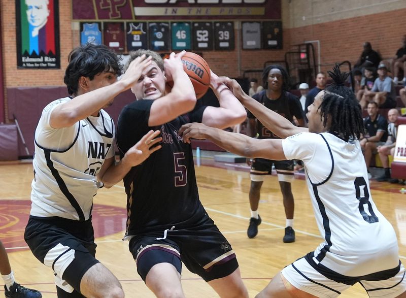 Iona Prep's Mike Kmetz (5) tries to get around Nazareth defenders in a game during the NYC CHSAA June Team Camp at Iona Prep in New Rochelle June 27, 2026.