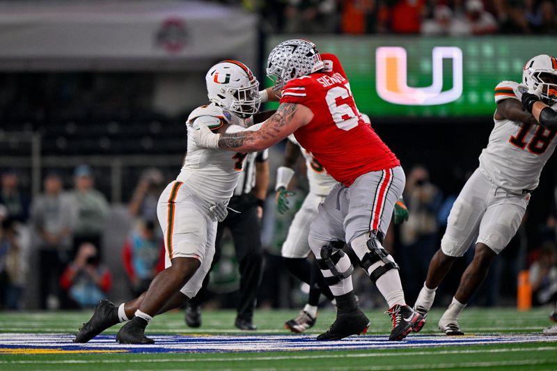 Dec 31, 2025; Arlington, TX, USA; Ohio State Buckeyes offensive lineman Austin Siereveld (67) blocks Miami Hurricanes defensive lineman Rueben Bain Jr. (4) during the 2025 Cotton Bowl and quarterfinal game of the College Football Playoff at AT&T Stadium. Mandatory Credit: Jerome Miron-Imagn Images