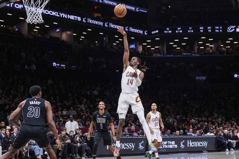 Mar 1, 2026; Brooklyn, New York, USA; Cleveland Cavaliers guard Keon Ellis (14) takes a jump shot in the second quarter against the Brooklyn Nets at Barclays Center. Mandatory Credit: Wendell Cruz-Imagn Images