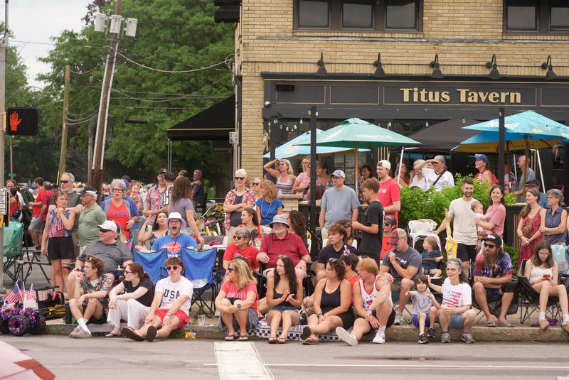 A crowd on Titus Avenue watches as different groups march by during the Fourth of July parade in Irondequoit on July 4, 2026.