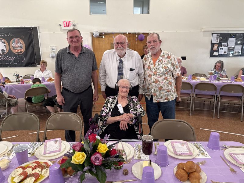 Pauline Reidy surrounded by her three sons, George Reidy, John Lee and Walter Reidy at Saturday's 100th birthday celebration at the North Baptist Church on Sly Avenue in Corning.