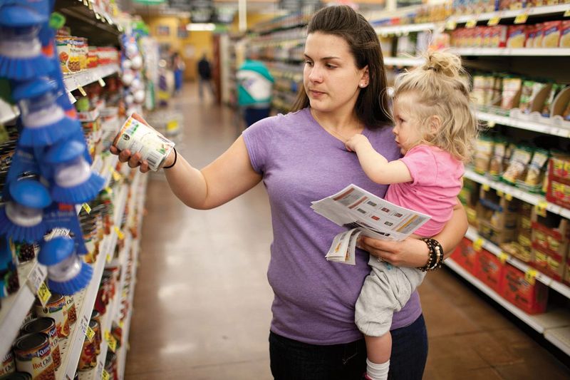 A woman browsing the shelves in the market.