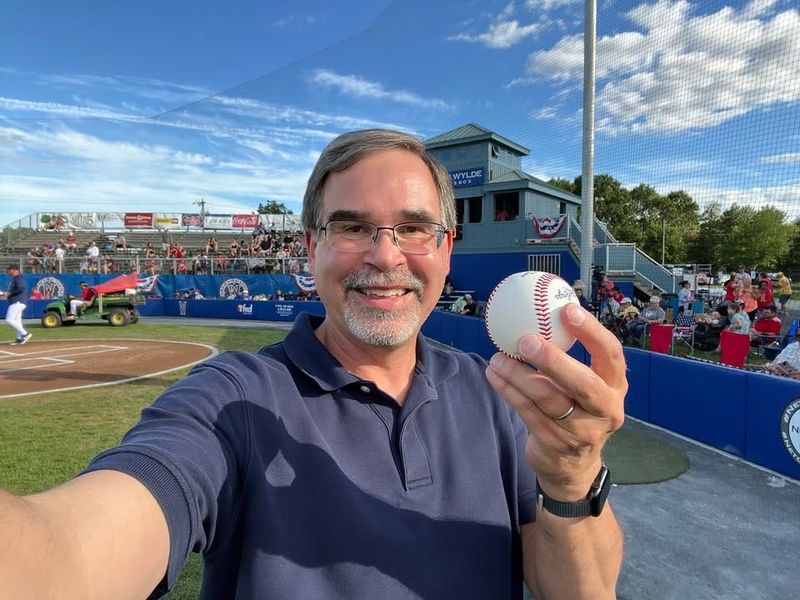 New Hartford native, children's book author of "Ballpark Mysteries" and "Football Mysteries" chapter book series, David A. Kelly, poses with a baseball to promote his books.