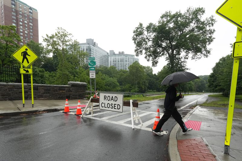 A road closed sign blocks off the Main Street entrance ramp for the Bronx River Parkway South in White Plains due to flooding July 21, 2026.