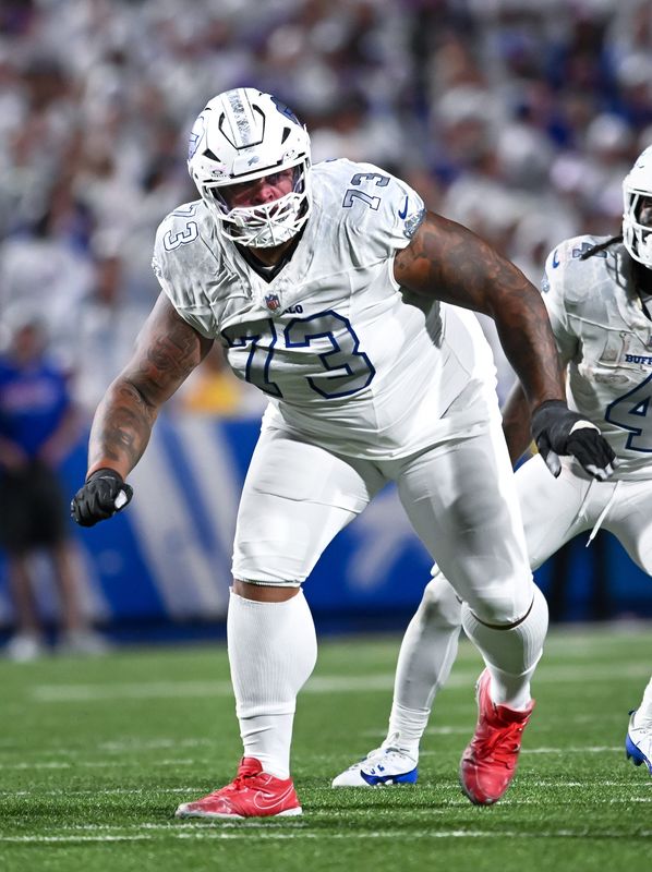 Oct 5, 2025; Orchard Park, New York, USA; Buffalo Bills offensive tackle Dion Dawkins (73) pass protects against the New England Patriots in the fourth quarter at Highmark Stadium.